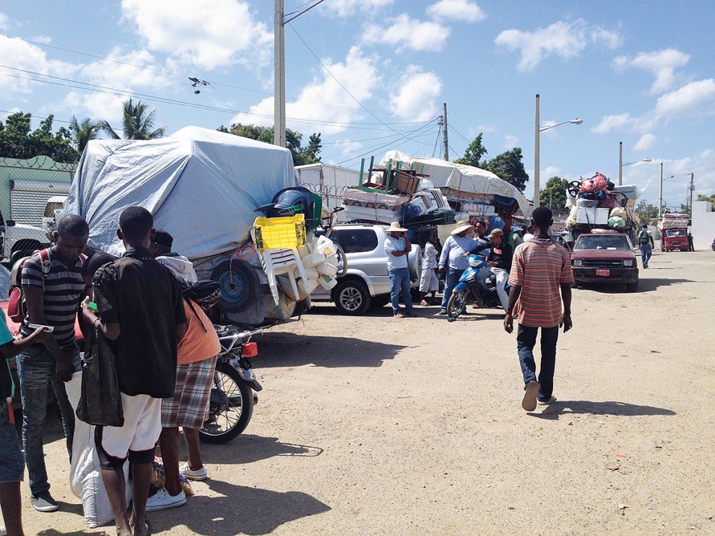 Mass exodus of Haitian migrants in Dajabon, at the northern border of the Dominican Republican and Haiti. In a matter of weeks, 40,000 Haitian migrants left the D.R. to avoid facing sudden deportation. Photo: Jheison Romain.