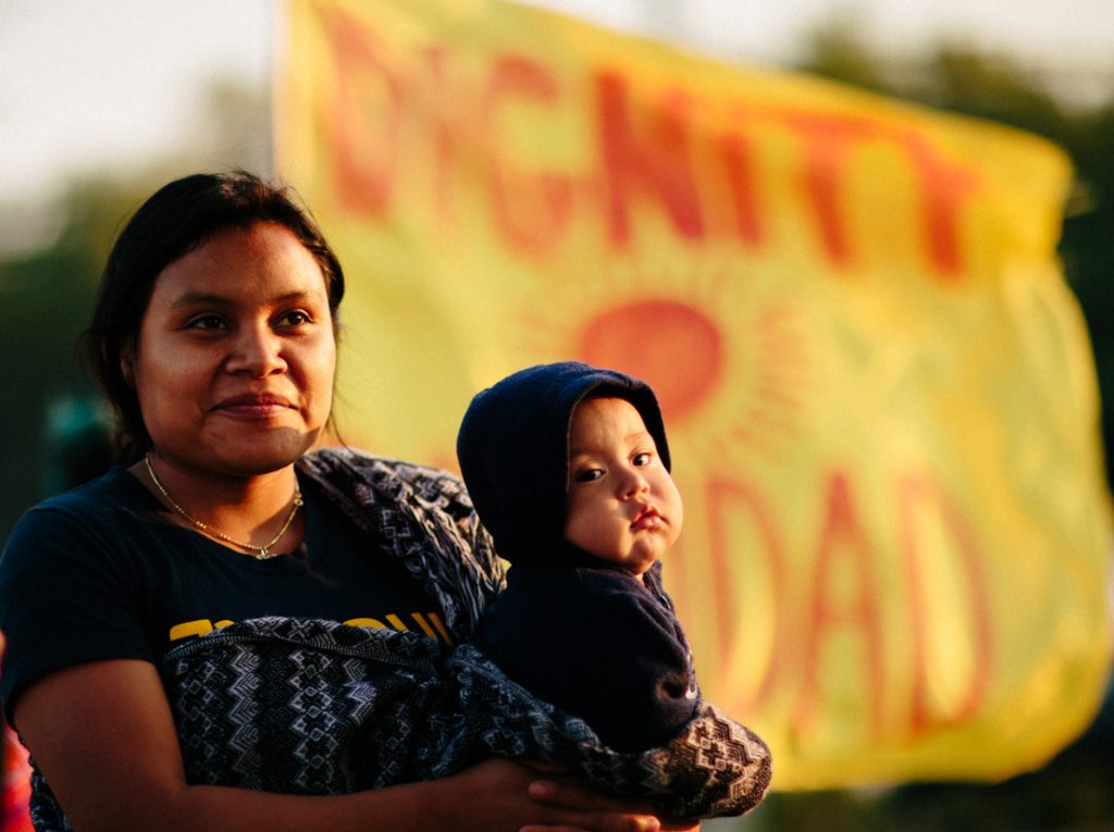 An Imokalee woman and her child encourage the Publix supermarket chain to join the Fair Food program. Photo: Forest Woodward.